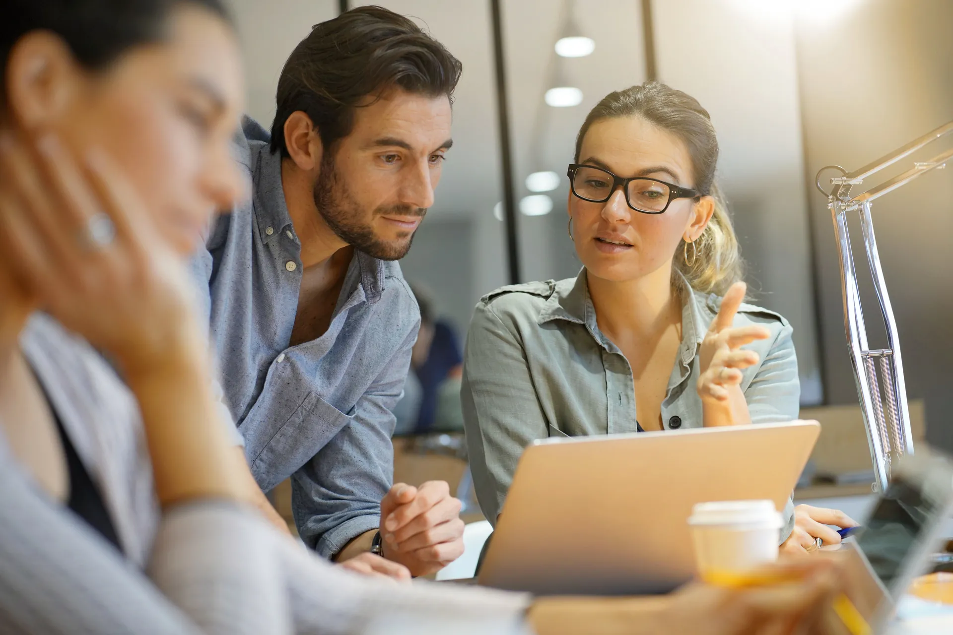 A business team collaborating around a shared operating system